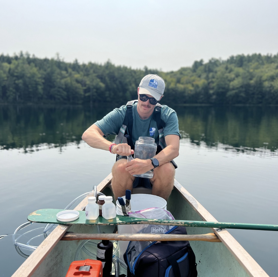 Silas collects water samples.